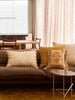 Gem Mustard 50cm Cushion styled