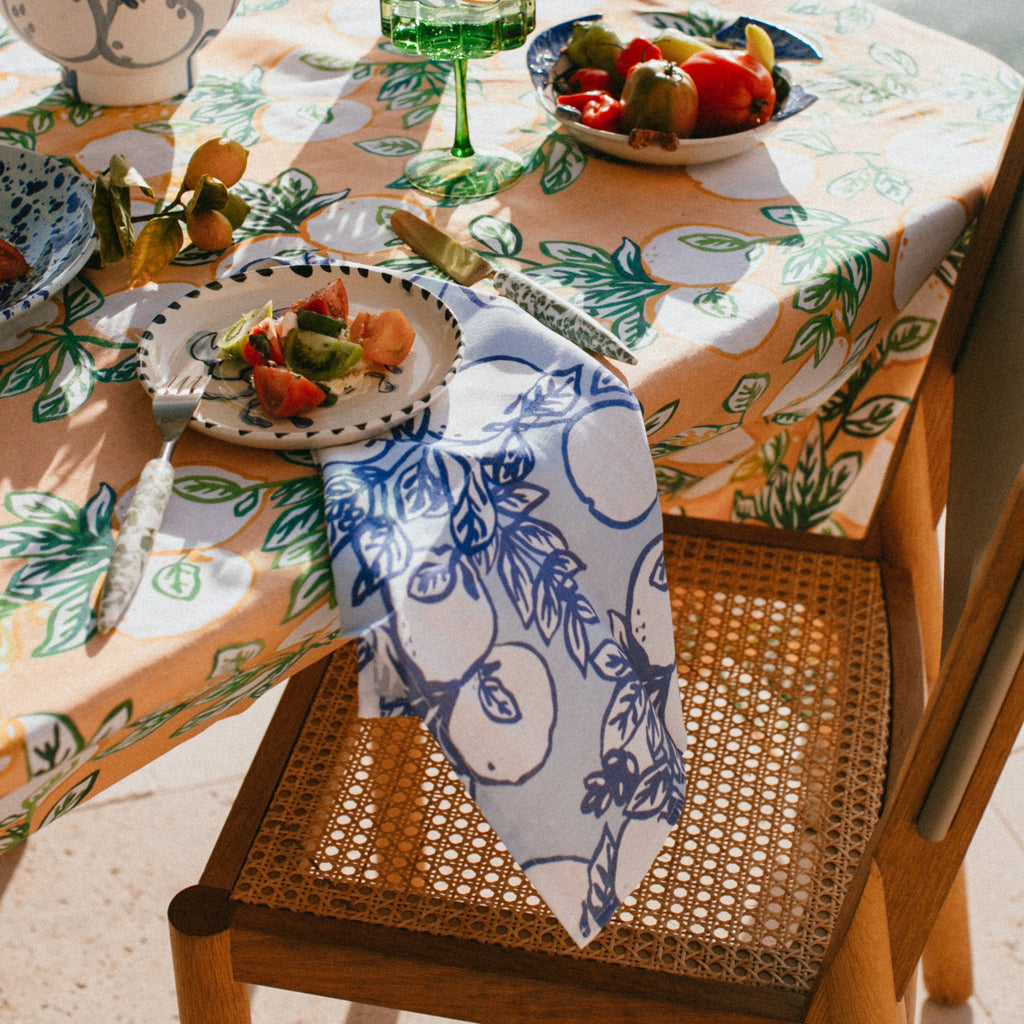 jumbled x bonnie and neil citrone linen napkin set. Hand painted lemons on branches in classic yves klein blue on a soft blue background